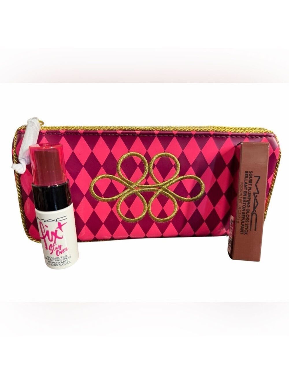 MAC Cosmetics
Squirt Plumping + Nourishing Lip Gloss & Mini Fix it. Makeup Bag